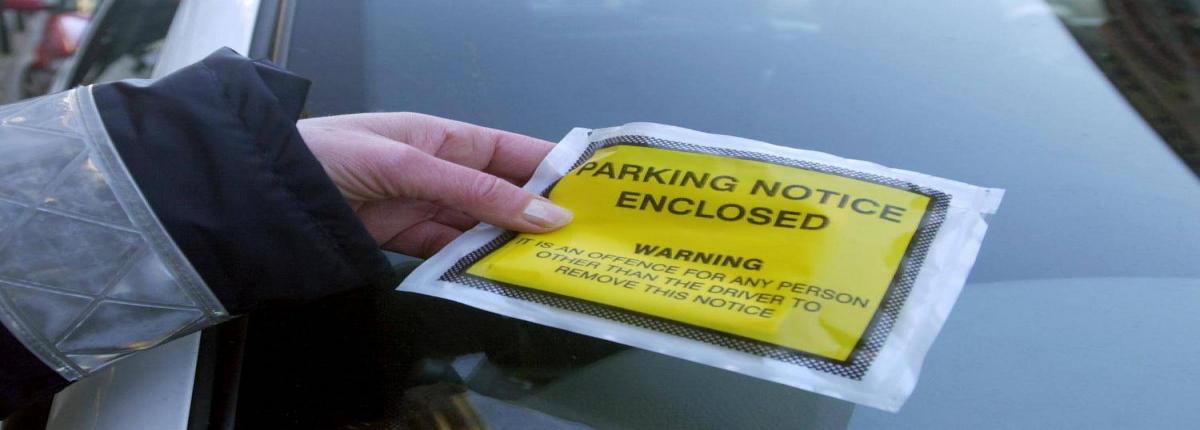 Parking ticket on the windscreen of car
